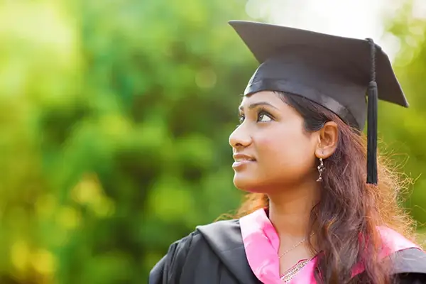 Young lady in a graduation gown.